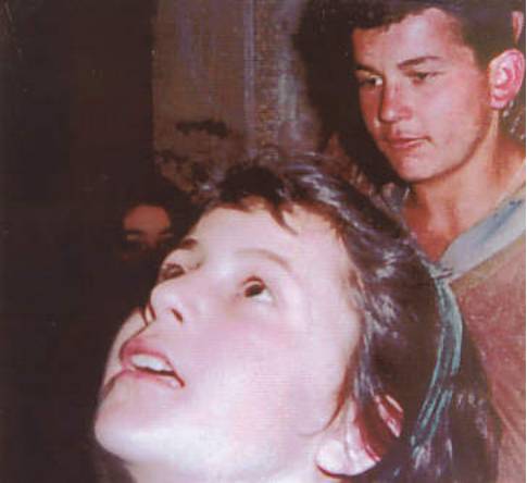 Two people looking upward, expressions focused.