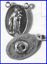 Religious medallion with engraved figures and text.