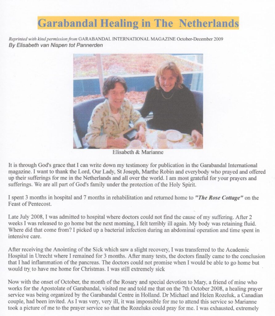 Two women sitting at a table, smiling.