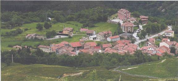Aerial view of a small village landscape.