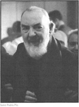 Elderly man with a white beard smiling.