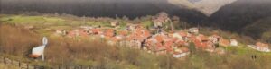 Mountain village with red-roofed houses.