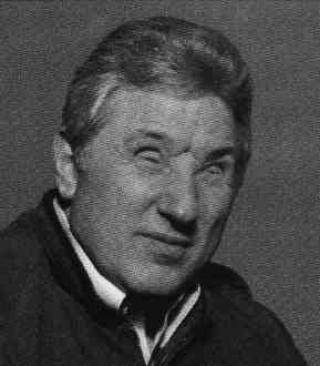 Older man with a serious expression.