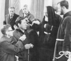 Religious ceremony with priest and participants.