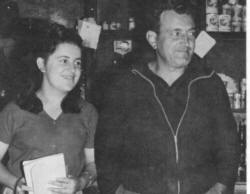 Man and woman standing in a store.