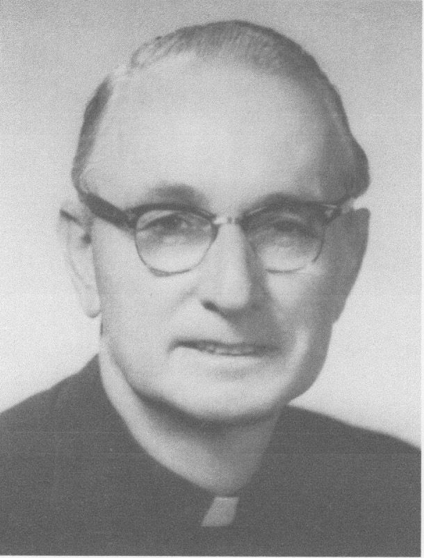 Elderly man with glasses and clerical collar.